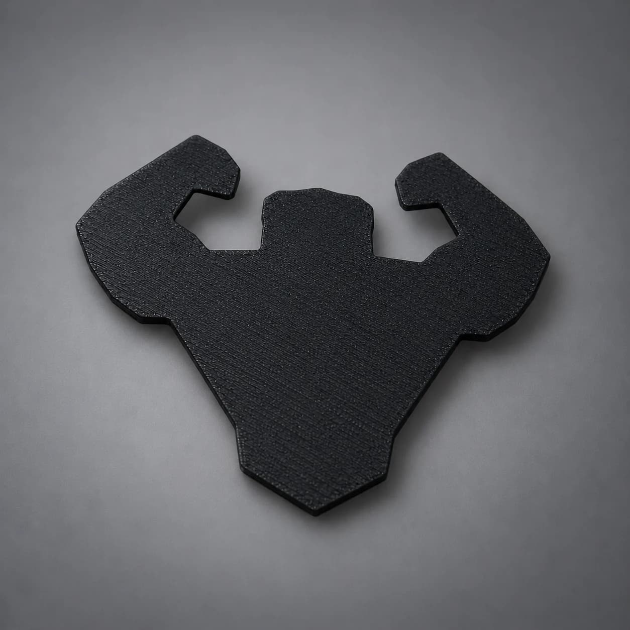 Spatele emblemei Built Wild, negru mat, tipărit 3D din PLA